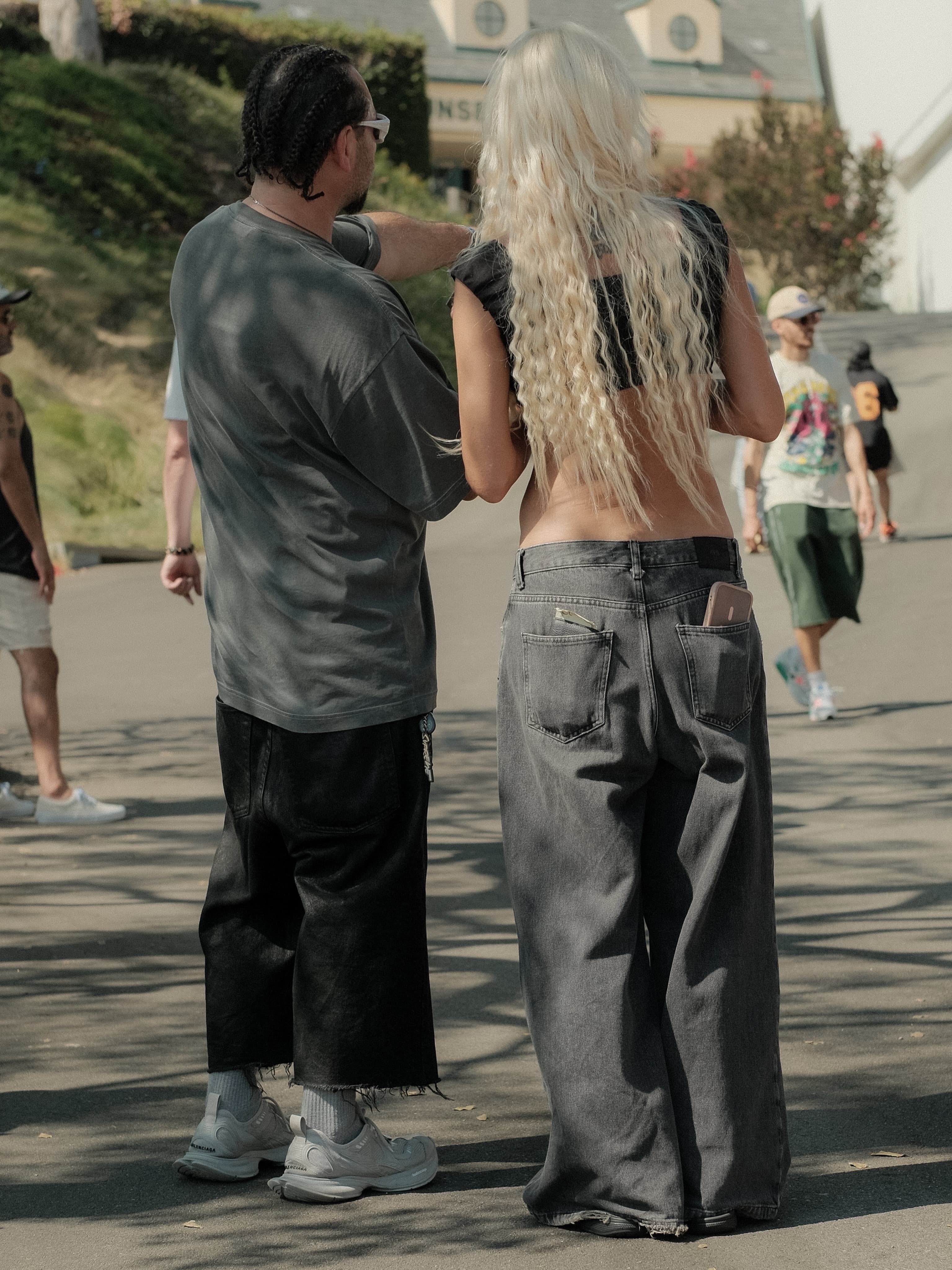 Cropped olive-grey tee and black trousers, next to an off-shoulder top and wide grey jeans, at Spinning Sunset