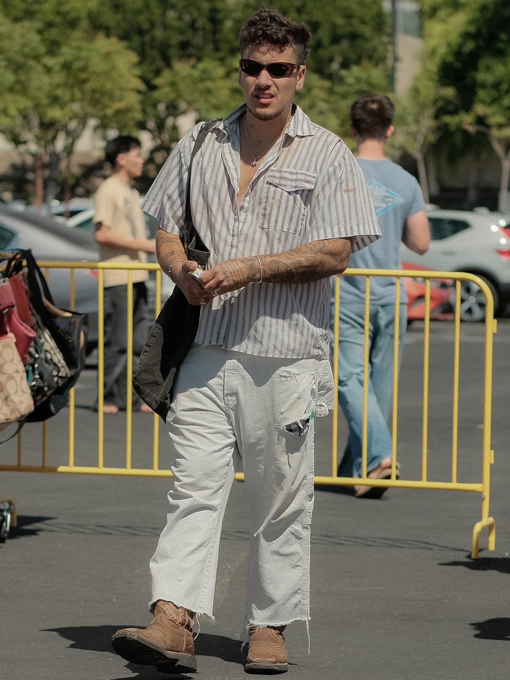 Striped shirt worn open, cropped raw-hem denim, at Silverlake Flea