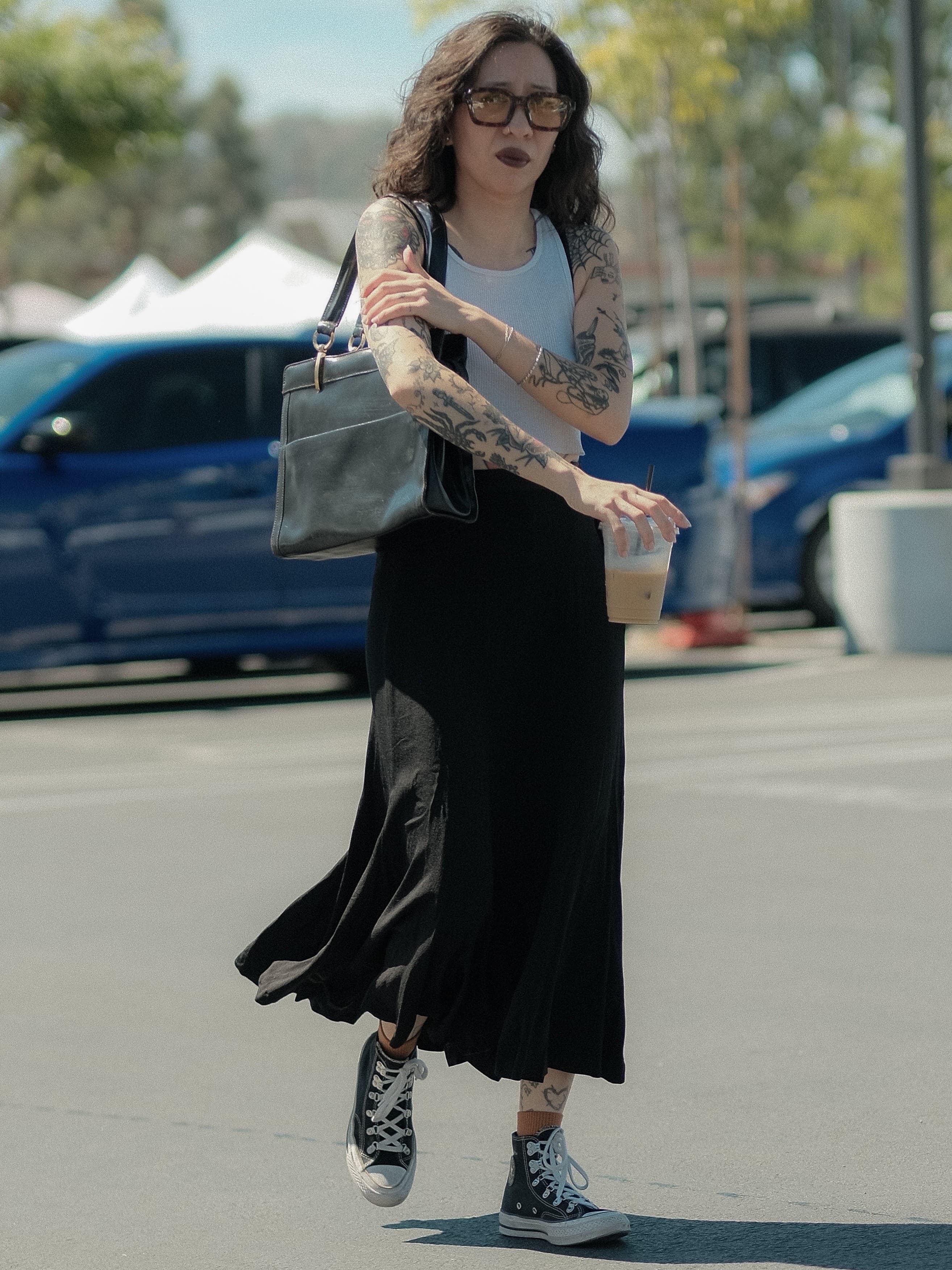 White tank, black slip skirt, full tattoo sleeves, at Silverlake Flea