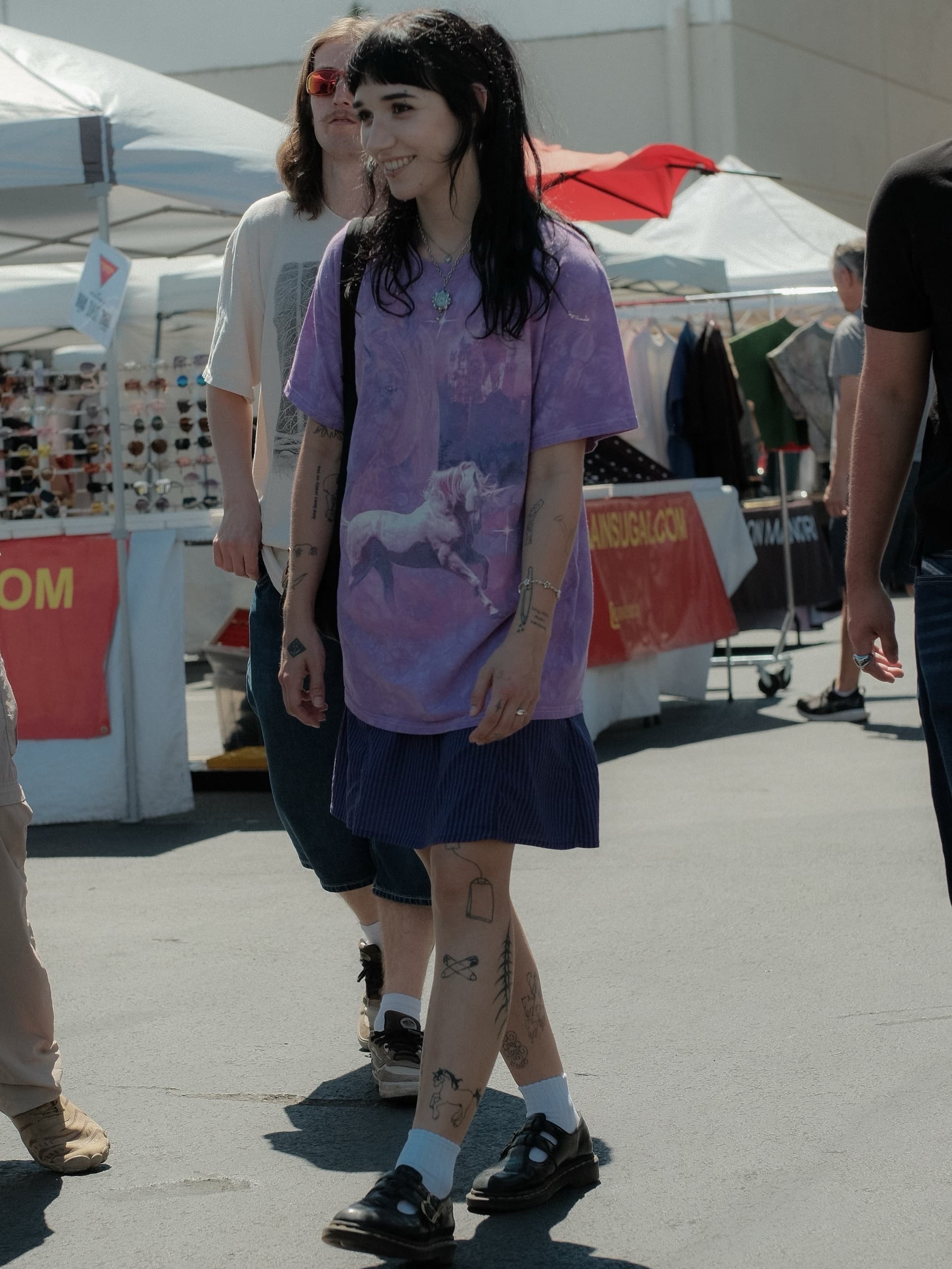Oversized purple graphic tee, navy striped skirt