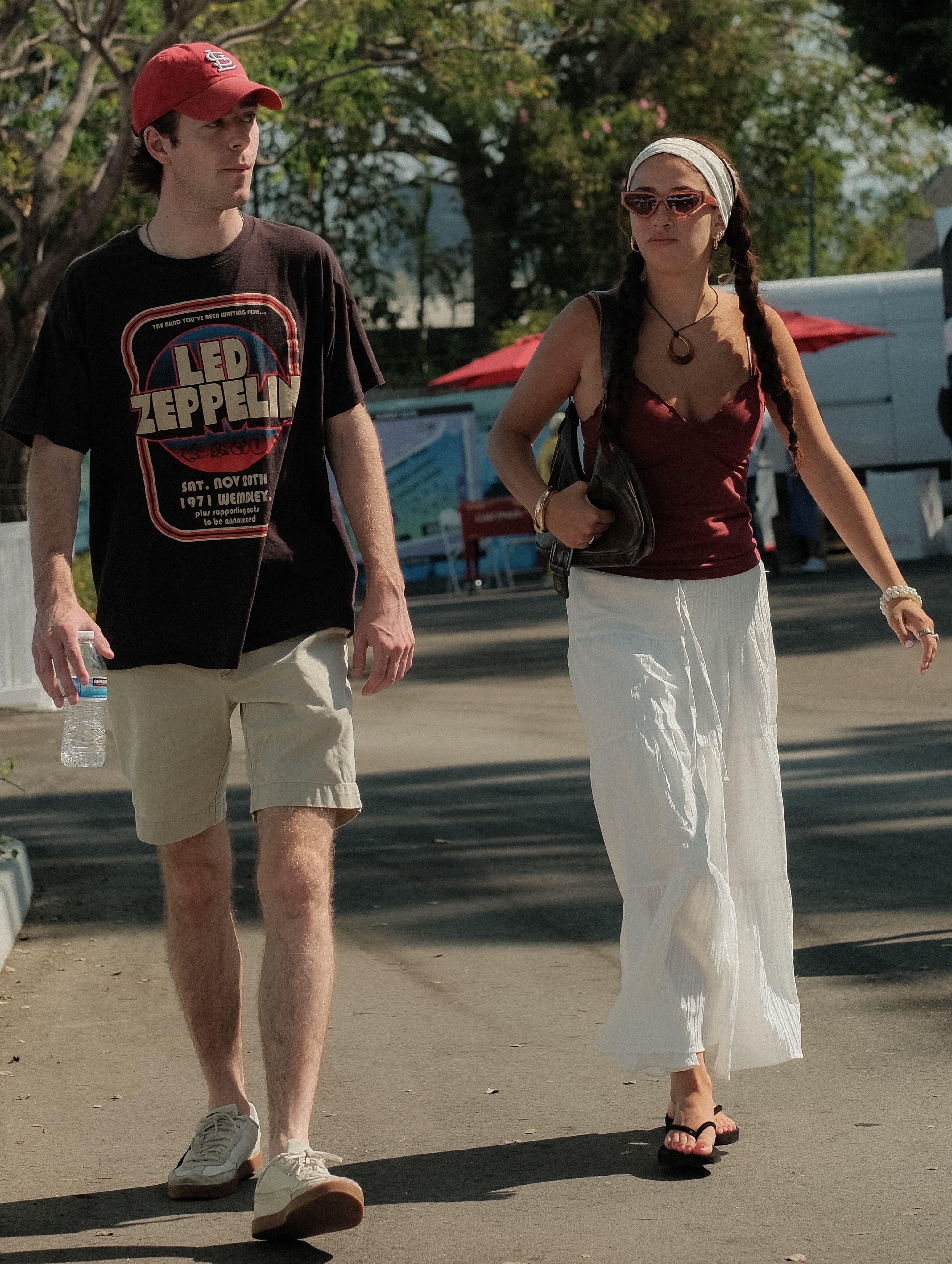 Vintage Led Zeppelin tee and khaki shorts, next to a maroon cami and white tiered maxi skirt, at Spinning Sunset