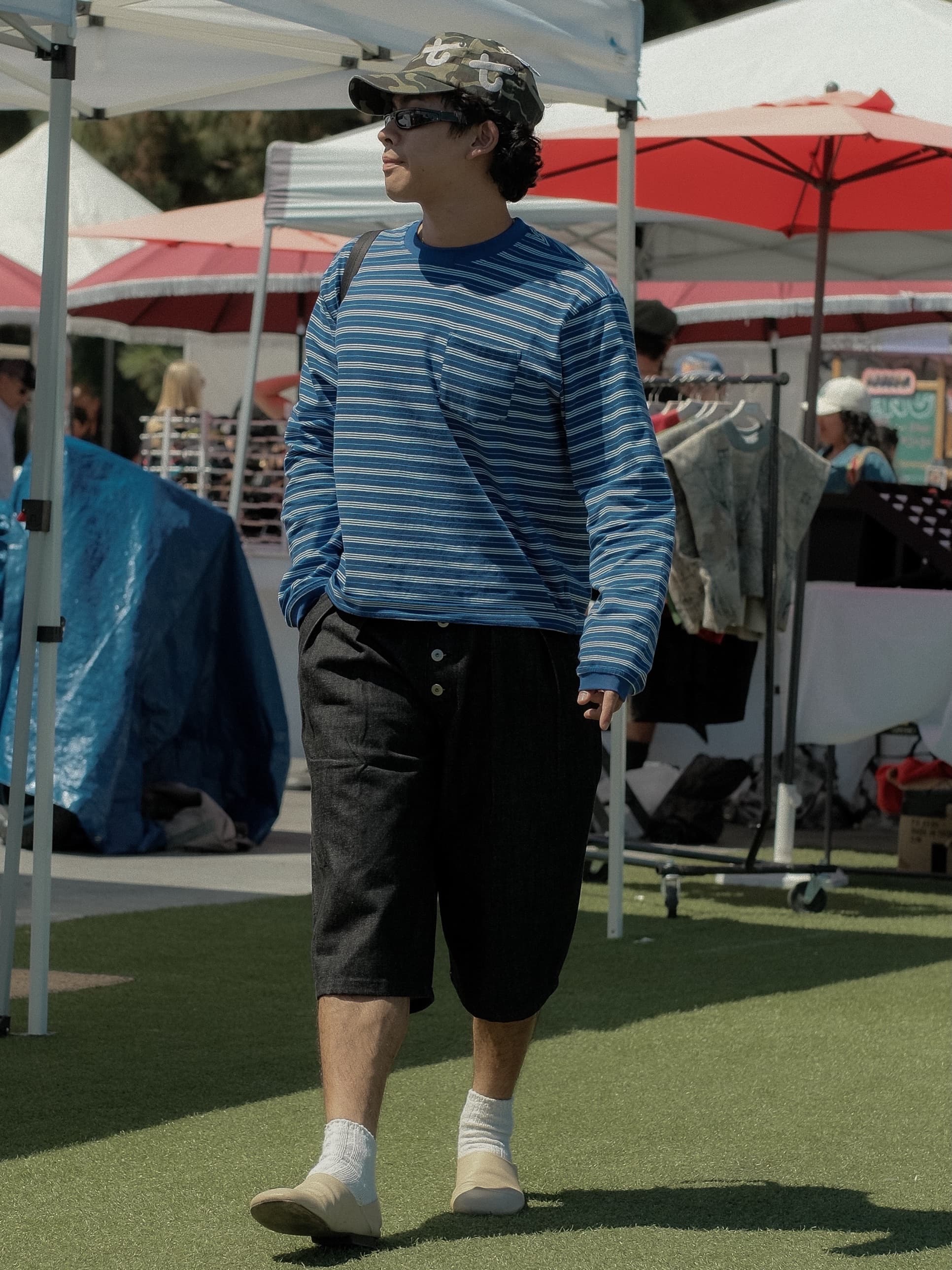 Blue striped long-sleeve, wide black shorts