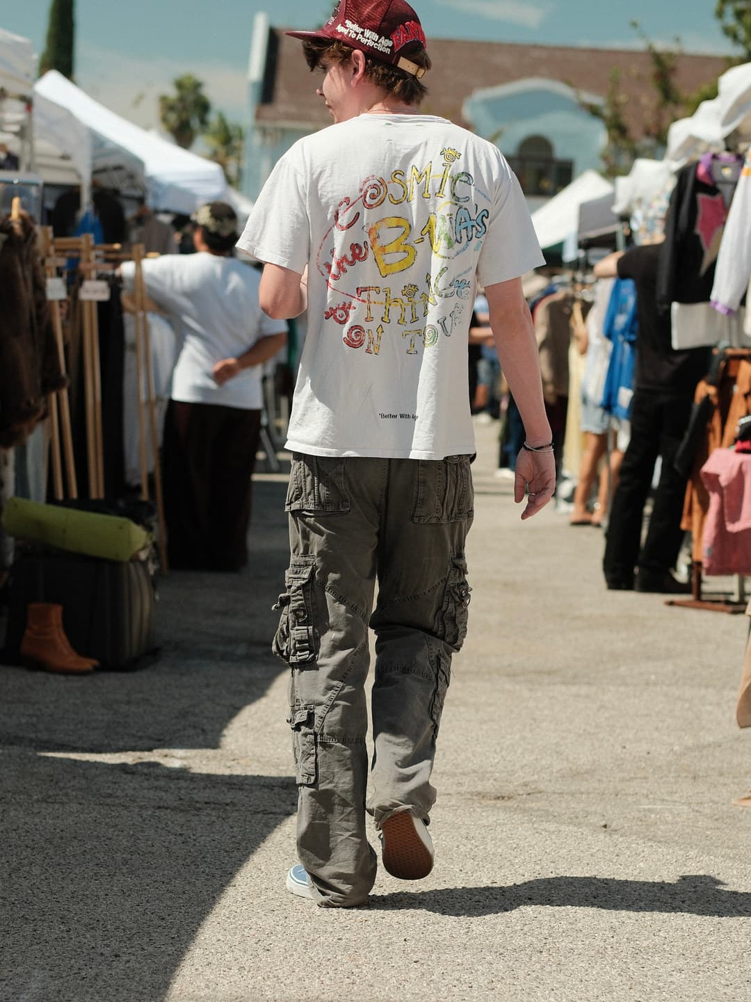 White tour graphic tee, olive green cargo trousers