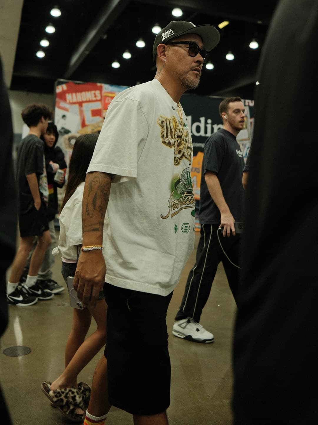 Cream oversized graphic tee, black track pants