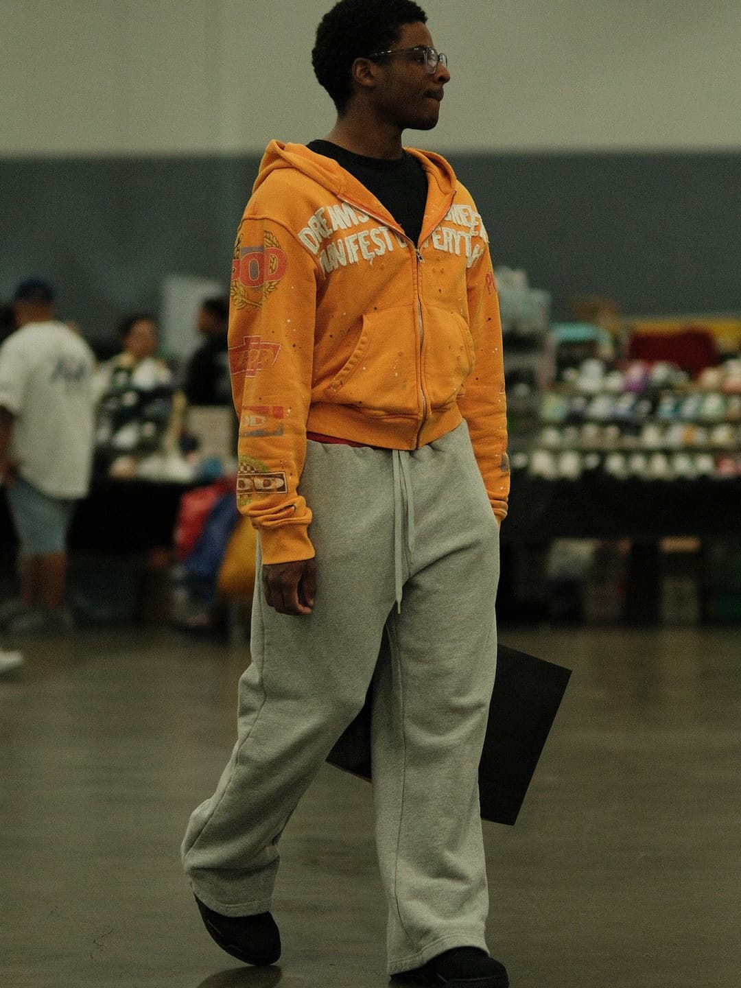 Orange collegiate hoodie, grey wide sweatpants