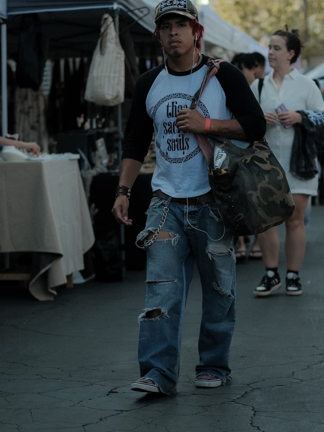 Gothic-script raglan with heavily ripped baggy jeans