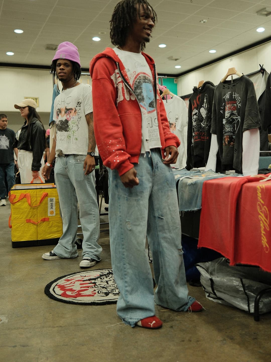 Red graphic hoodie, very wide light-wash jeans