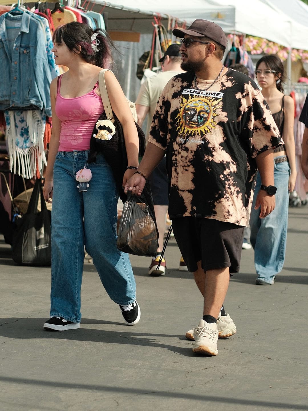 Floral tank with wide blue jeans, bleach tie-dye band tee