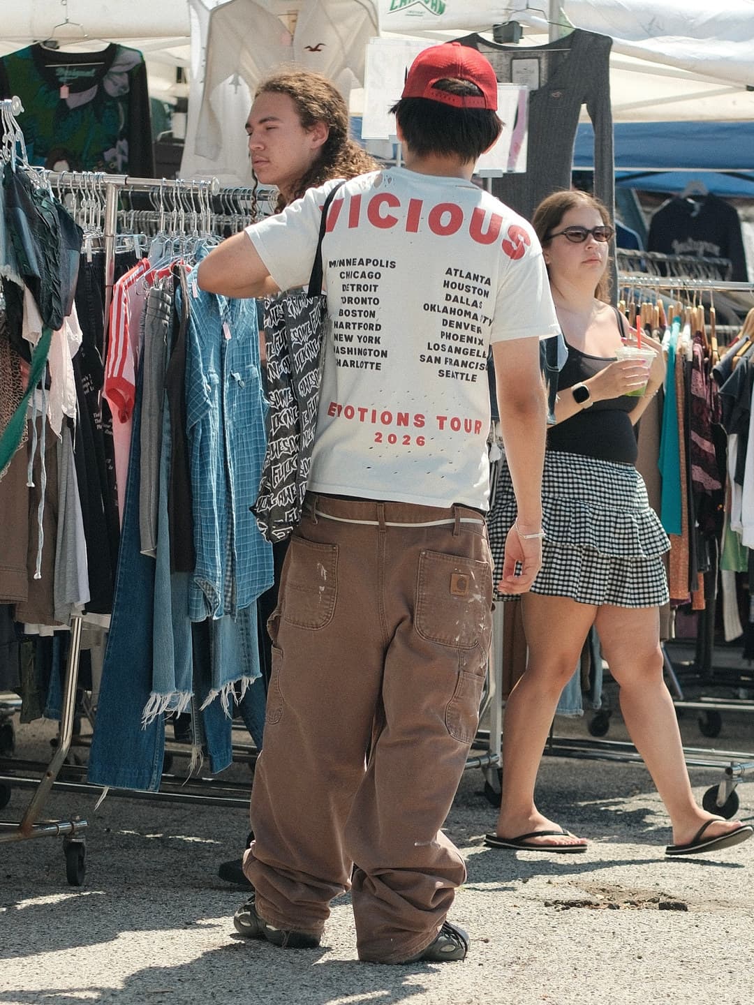 White tour graphic tee, brown double-knee carpenter trousers
