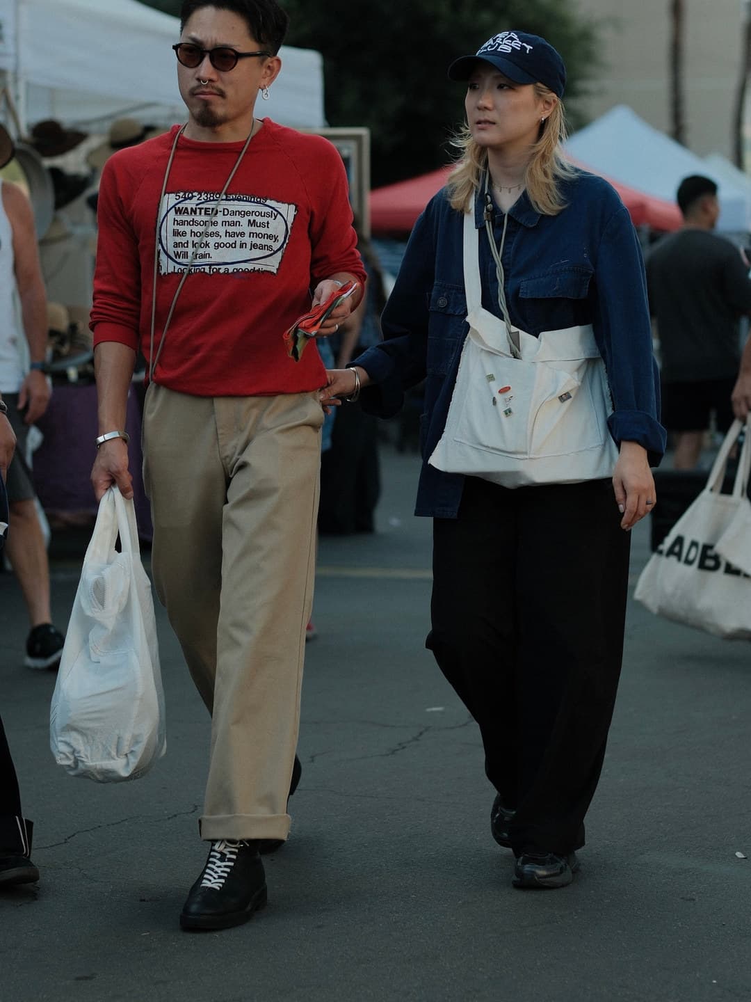 Red text-print sweatshirt with cuffed khakis, denim chore jacket